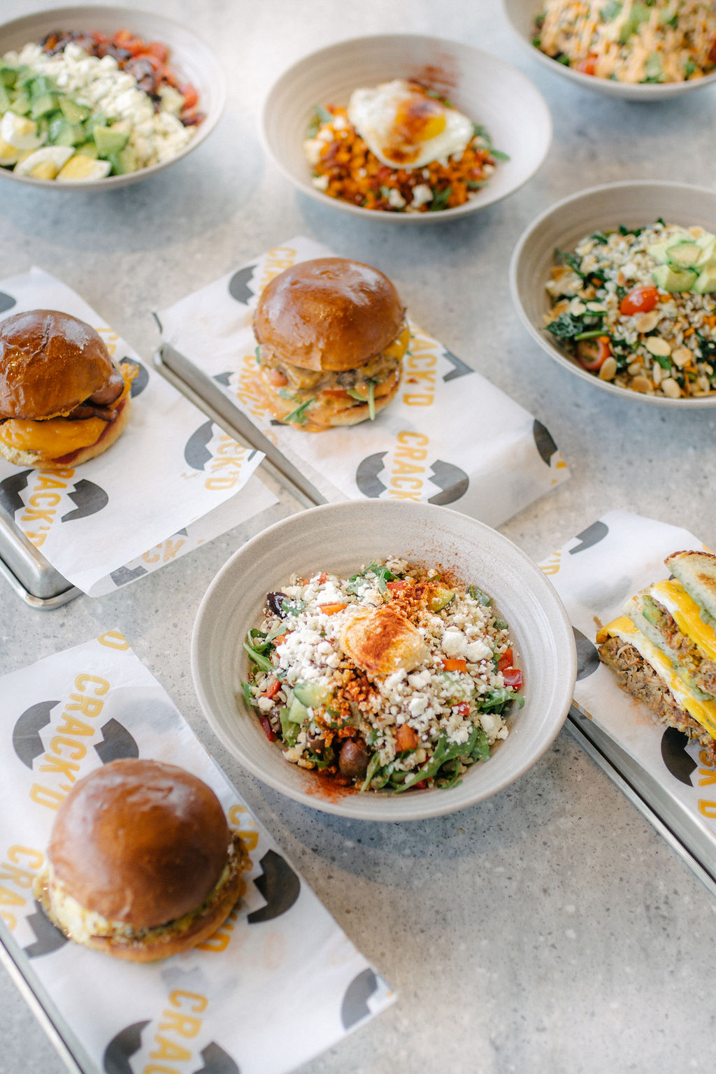 Variety of dishes including salads and burgers