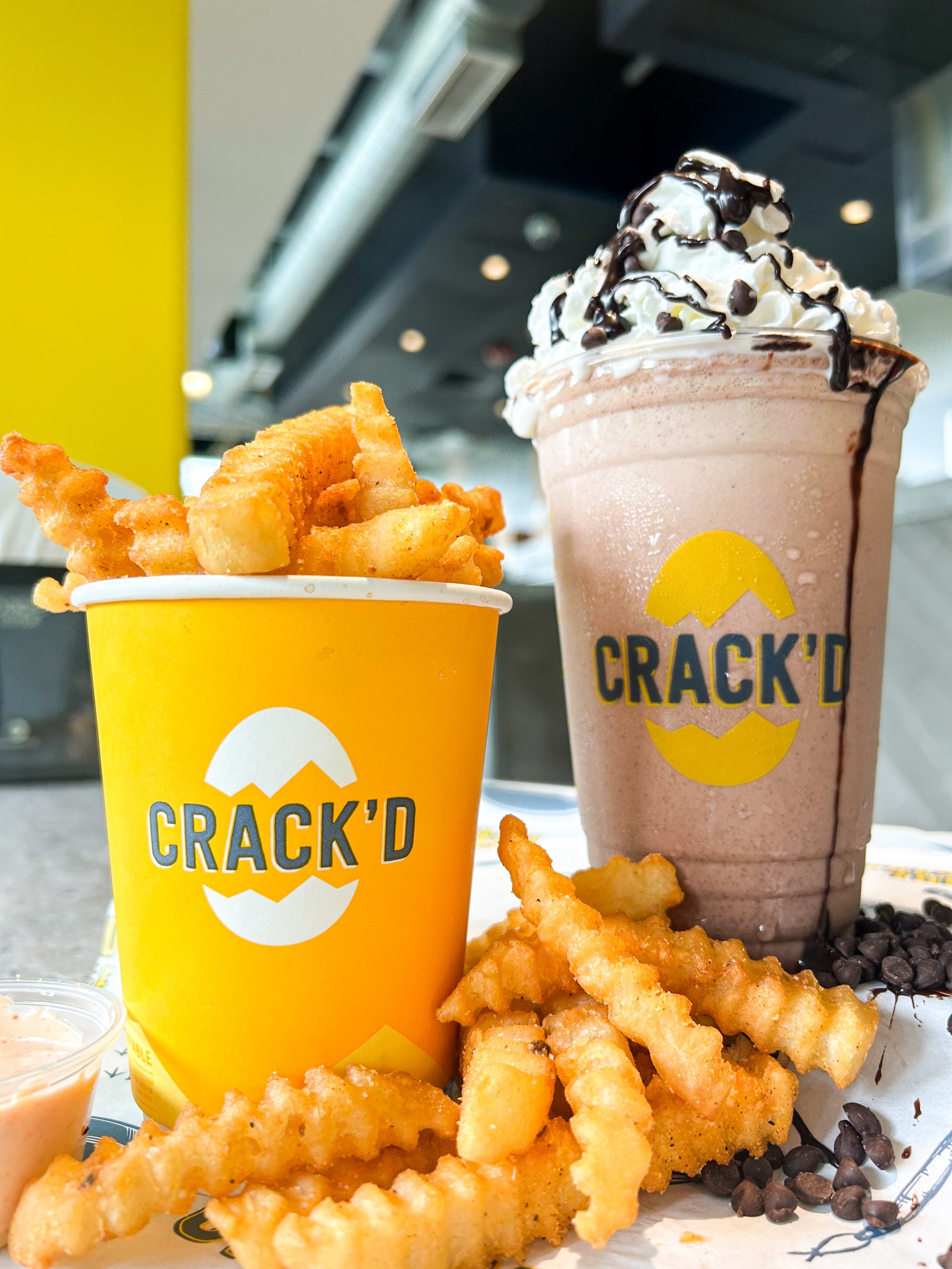 Crunchy fries paired with a chocolate shake topped with whipped cream.
